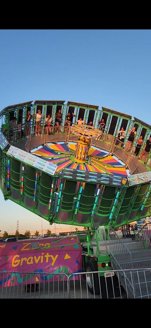 carnival ride Ride Carnival Spin Zero Gravity Gravity Spinning Wheel Multi Colored Sky