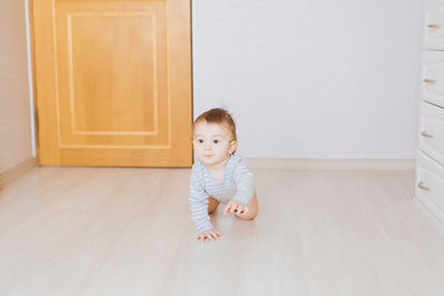 Portrait of cute baby girl at home