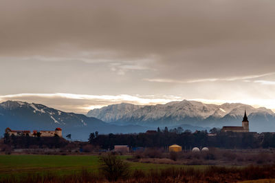 Scenic view of landscape and mountains against sky