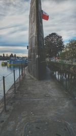 Road amidst city against sky