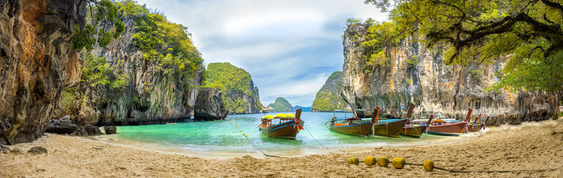 Panoramic view of rocks on beach against sky