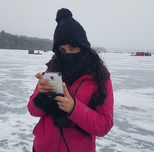 Silhouette of woman looking at sea