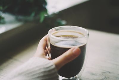 Close-up of hand holding drink