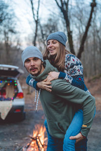 Young couple standing in park during winter