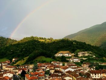 Scenic shot of rainbow over mountain range