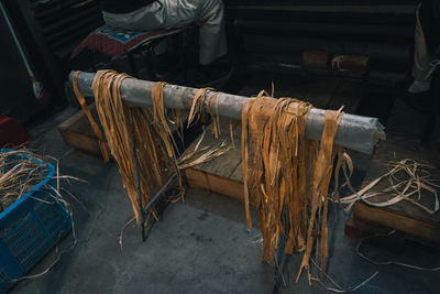 High angle view of wooden shavings on stand at workshop