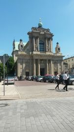 People in front of historical building