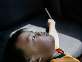 Close-up of boy looking up