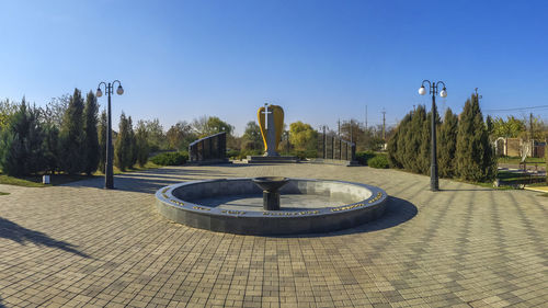 View of park against clear blue sky