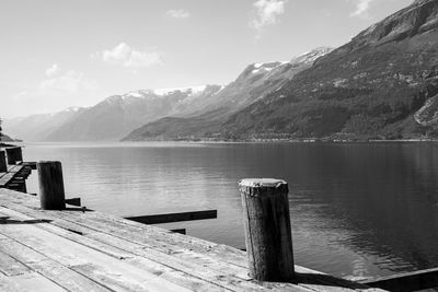 Pier on lake against mountains