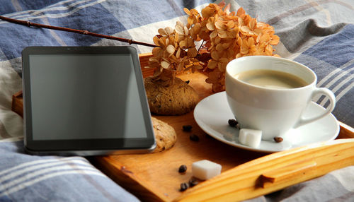 Close-up of cup and coffee on table