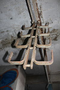 Low angle view of rusty metal on wall