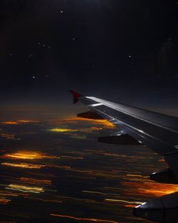 Airplane flying in sky at night