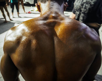 Rear view of shirtless muscular man