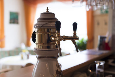 Close-up of electric lamp on table