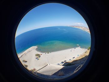 Scenic view of sea seen through airplane window