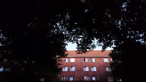 Low angle view of building against sky at night