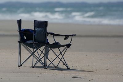 Empty beach with sea in background