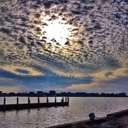 Scenic view of sea against cloudy sky