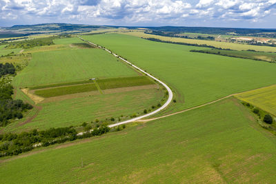 Scenic view of farm against sky