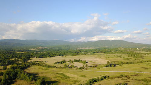 Scenic view of agricultural field against sky