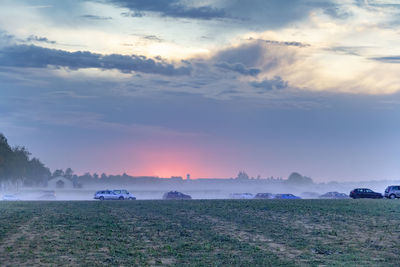 Scenic view of field against sky during sunset