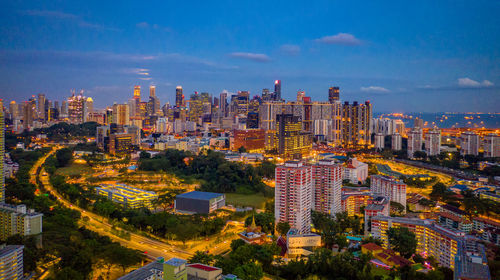 High angle view of buildings in city against sky