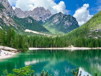 Scenic view of lake and mountains against sky