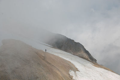 Scenic view of mountains against sky during foggy weather