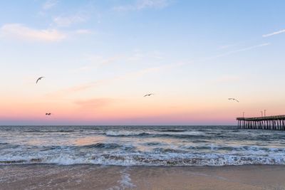 Scenic view of sea against sky during sunset