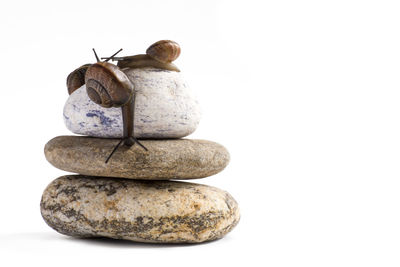 Close-up of stones against white background