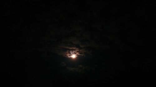 Low angle view of moon in sky at night