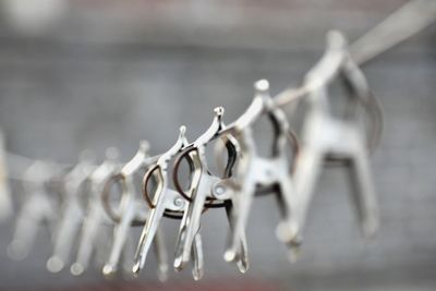 Close-up of decoration hanging on metal fence