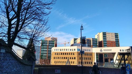 Low angle view of buildings against blue sky