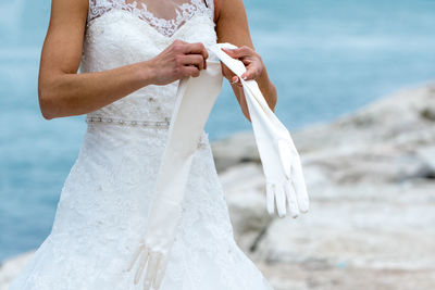 Newly married woman by the sea