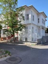 Street by building against sky