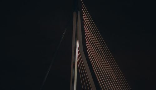 Low angle view of illuminated building against sky at night