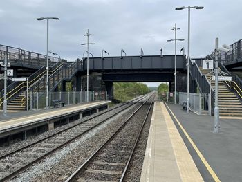 Railroad station platform against sky