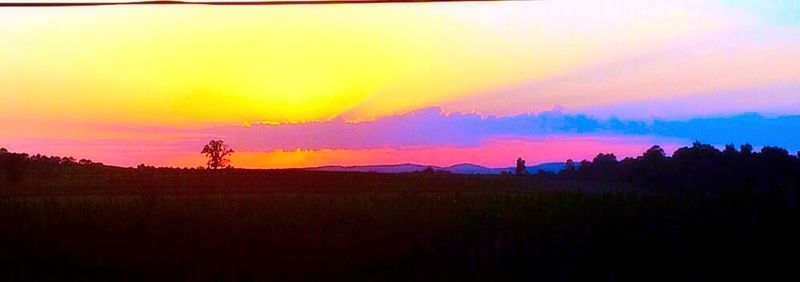 Scenic view of landscape against sky during sunset