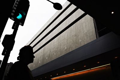 Low angle view of illuminated street light against sky