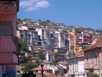 Exterior of buildings in town against sky