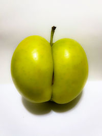 Close-up of apple against white background