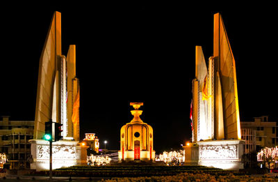 Illuminated building against sky at night