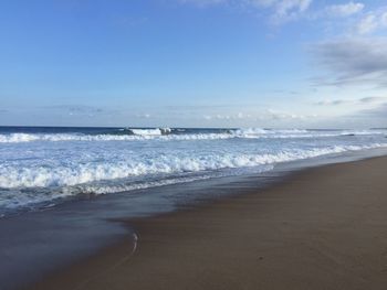 Scenic view of beach against sky