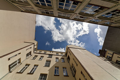View of buildings against cloudy sky