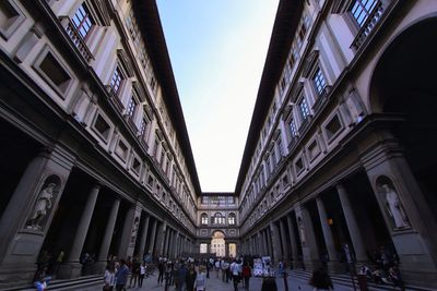 Group of people walking in building