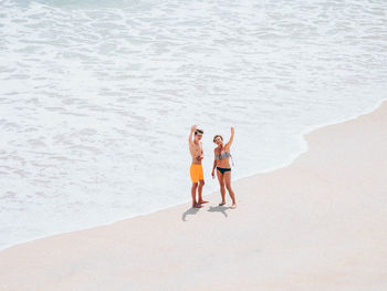 Woman standing on beach