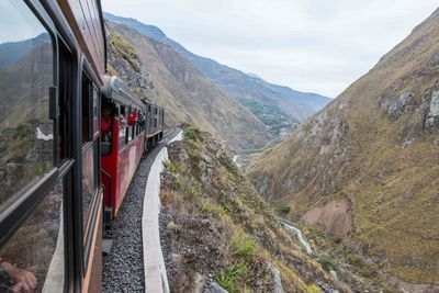 Train on mountain against sky