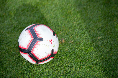 Close-up of soccer ball on field