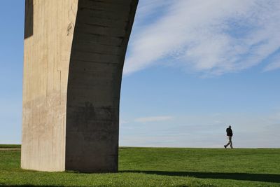 Man on field against sky